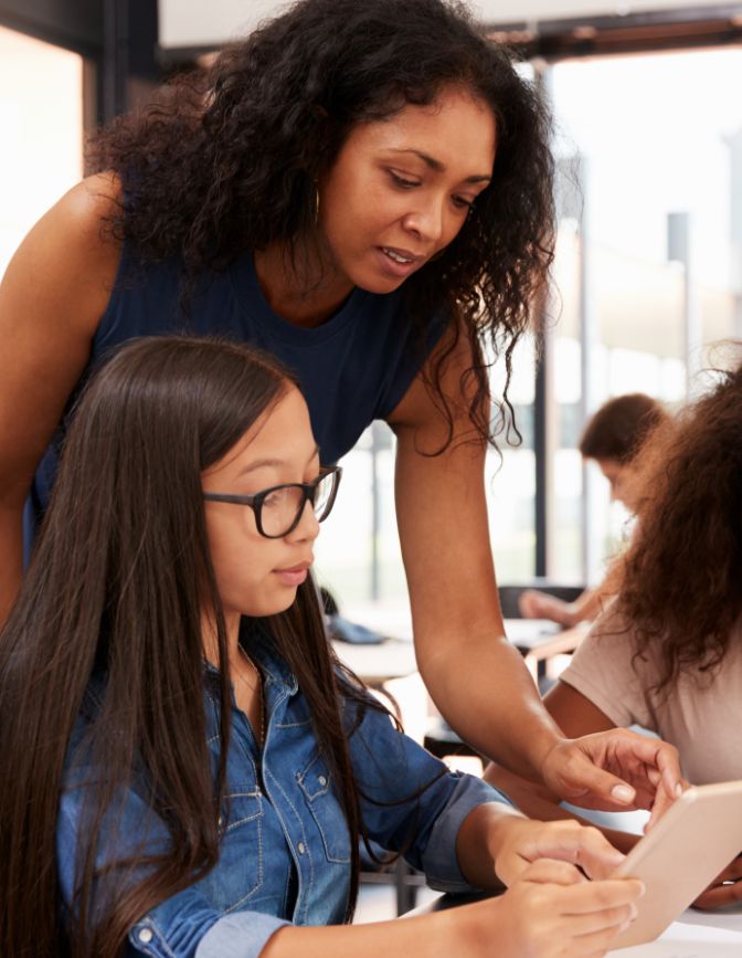 K12 teacher and student with tablet