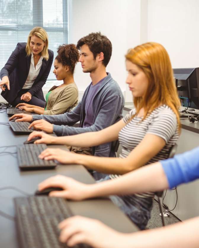 teacher and students in computer lab